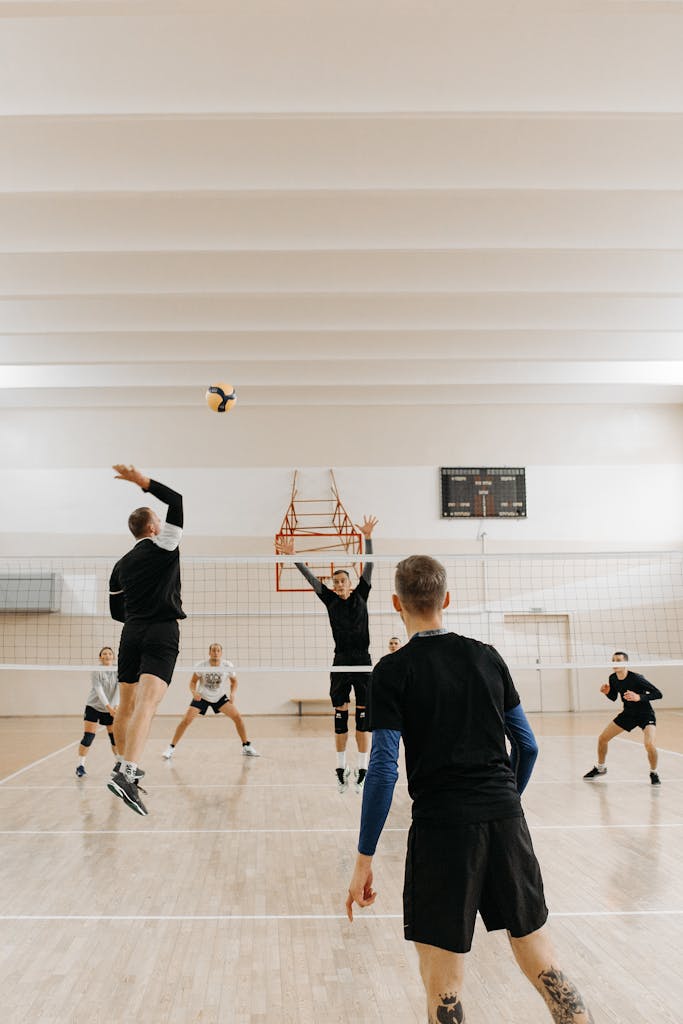 Man in Black T-shirt Playing Volleyball